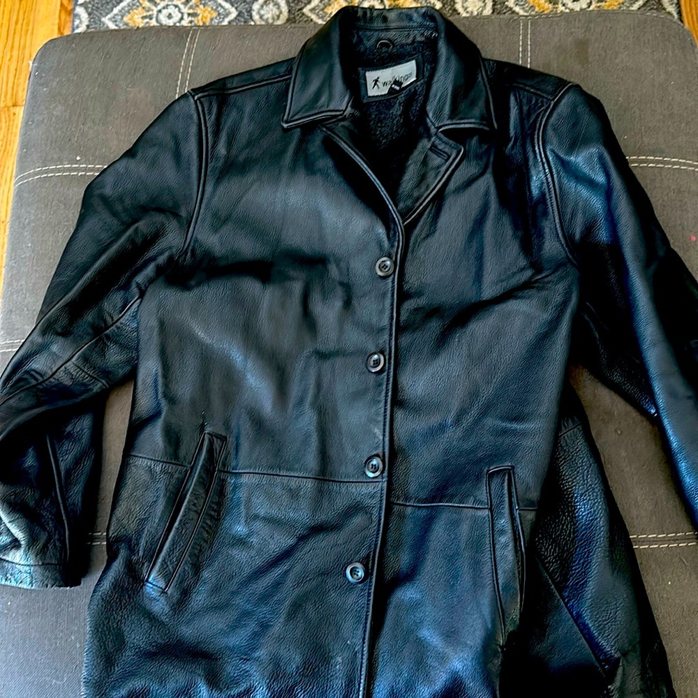Leather jacket with mark which may be removable.  Discounted price regardless.